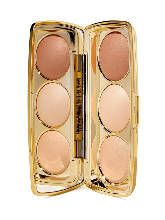 Makeup palette with six beige shades in a gold case on a white background